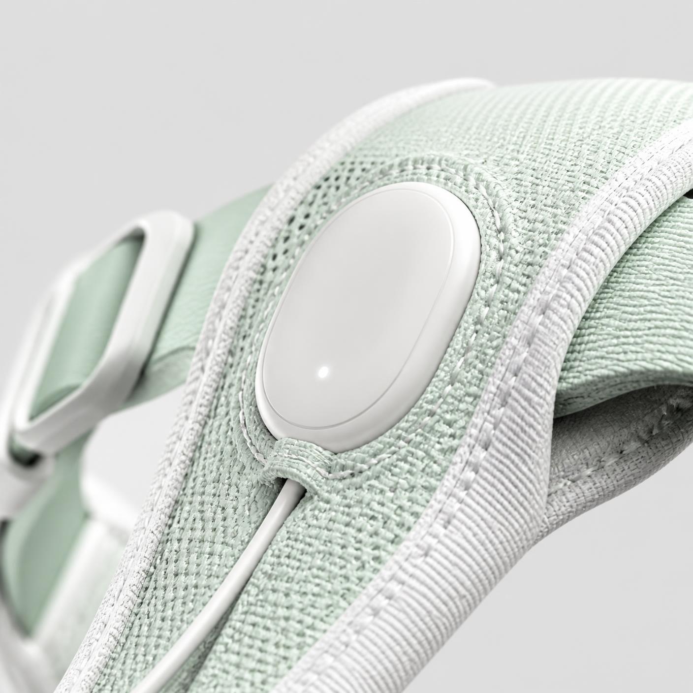 Close-up of the flush control module and tension cable on the Leashless harness